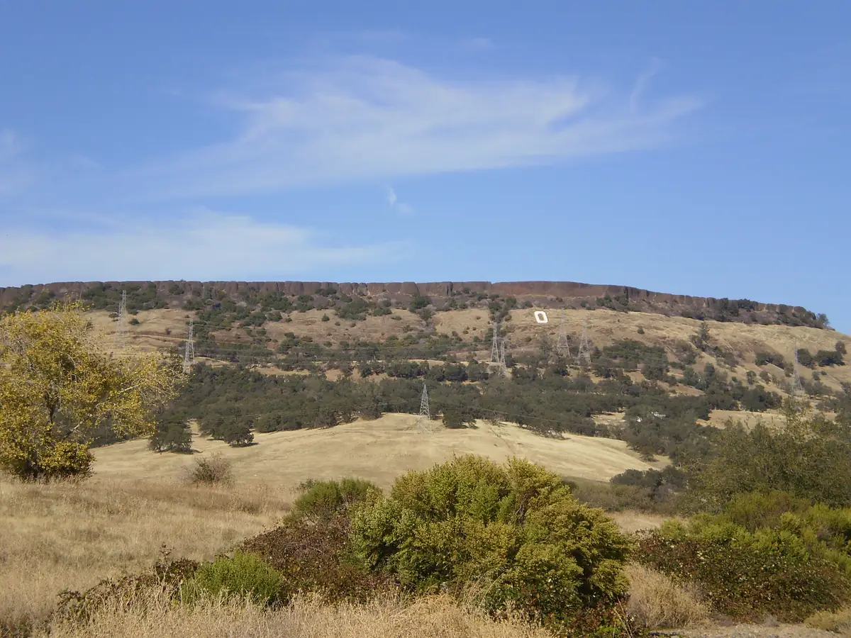 Table Mountain rising above dry golden grassland at the edge of the Butte County valley floor